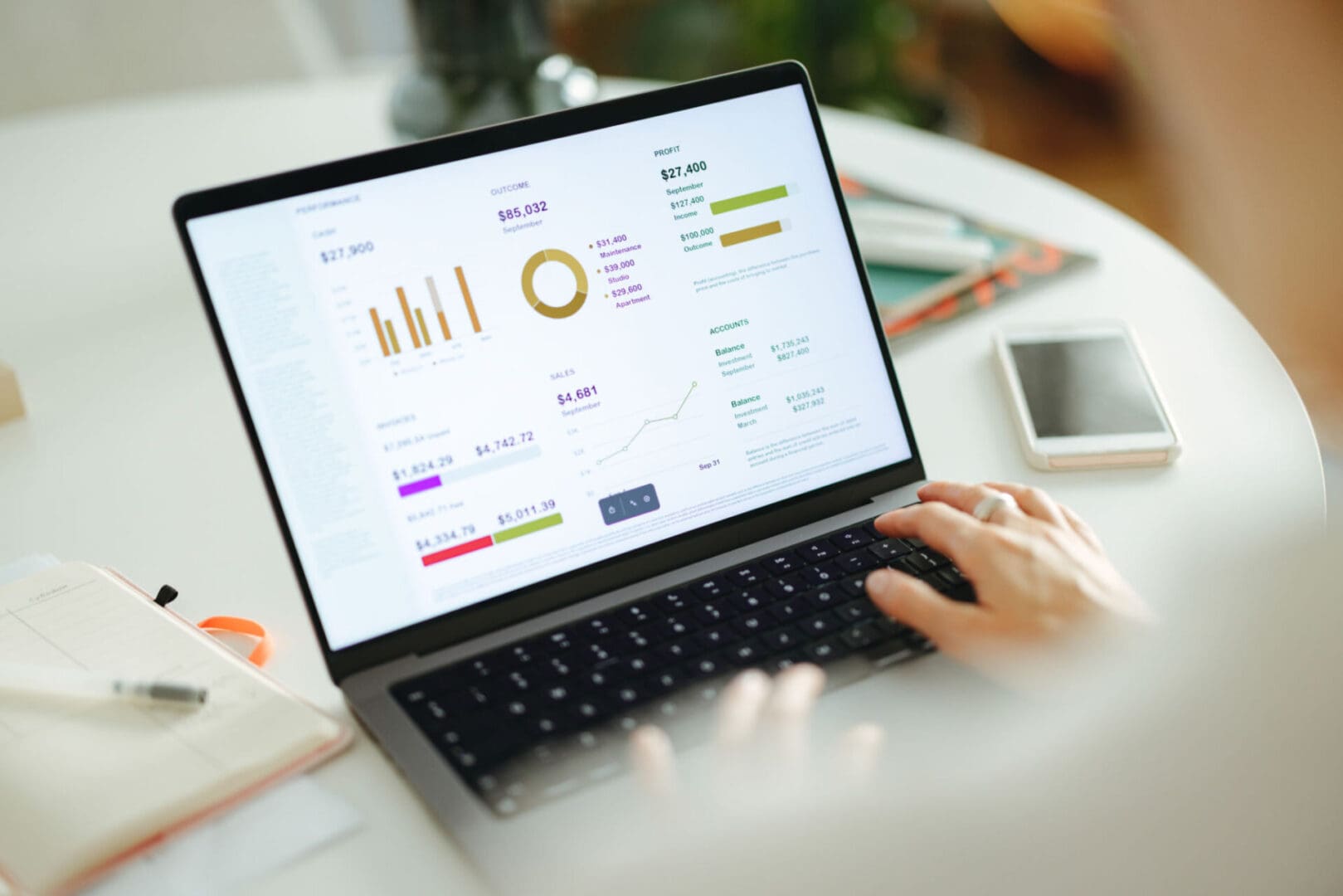 Person analyzing data on a laptop screen.